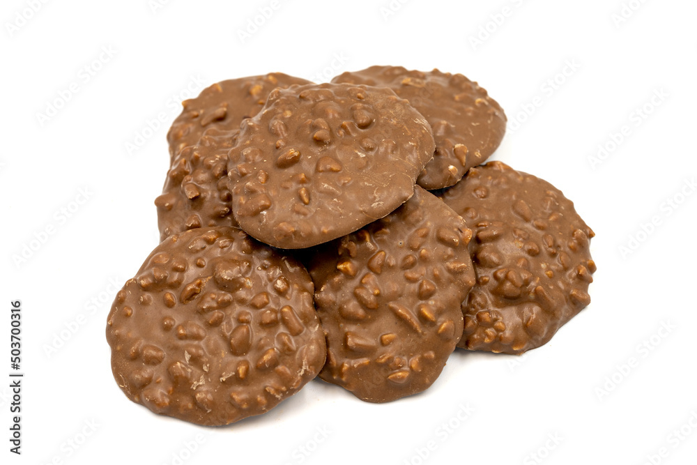 Special chocolate with hazelnut particles. Chocolate with hazelnuts on a white background. close up Special chocolate with hazelnut particles. Chocolate with hazelnuts on a white background. close up