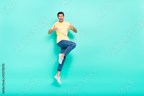 Fototapeta Naklejka Na Ścianę i Meble -  Full body photo of excited cheerful person two hands show thumb up isolated on turquoise color background