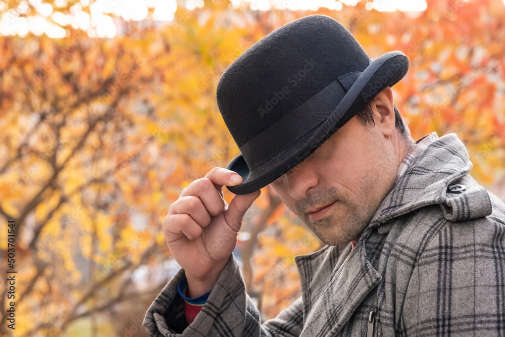 Obraz premium Man in black hat outdoors in the park. Urban lifestyle