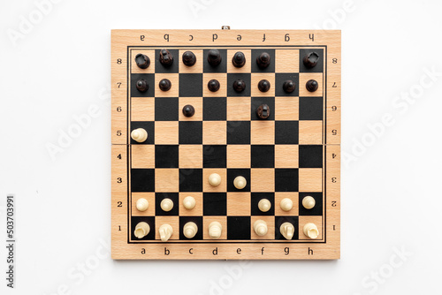 Fototapet Winner of game concept. Chess pieces battle on chessboard