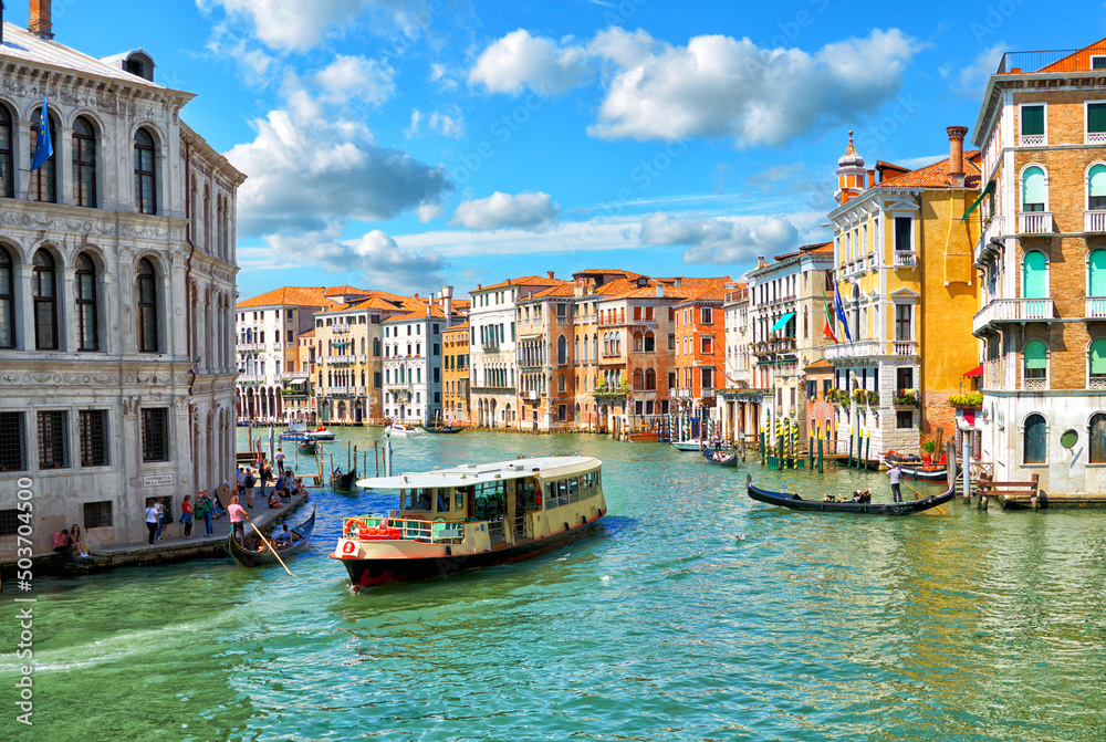 Scenic view of the Grand Canal, floating boats and gondolas in Venice