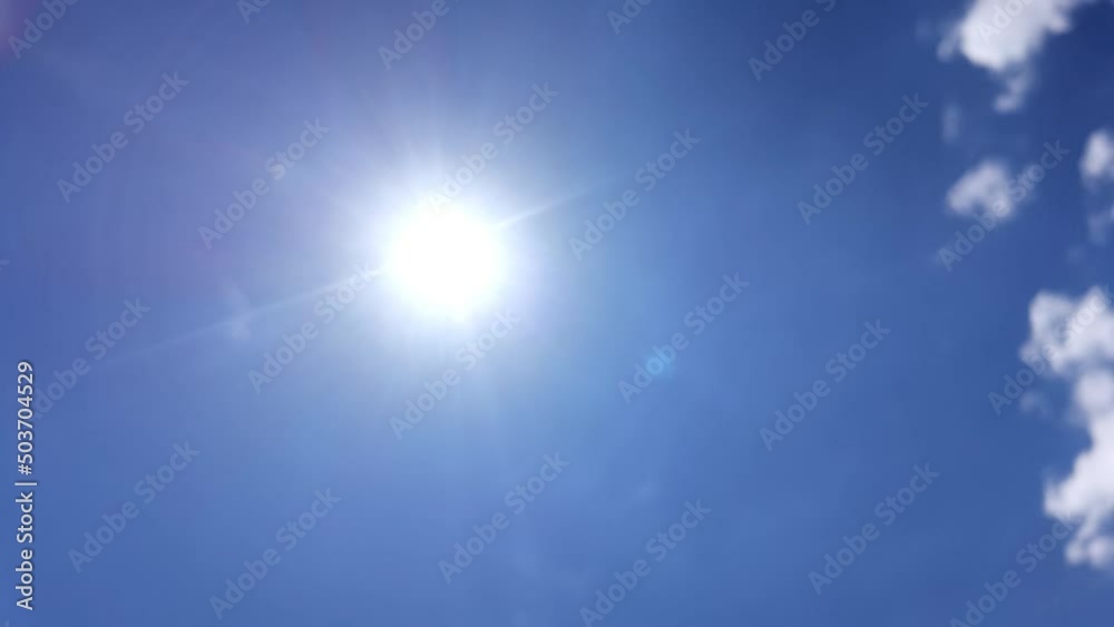 sun clouds traveling in blue sky background in spring season

