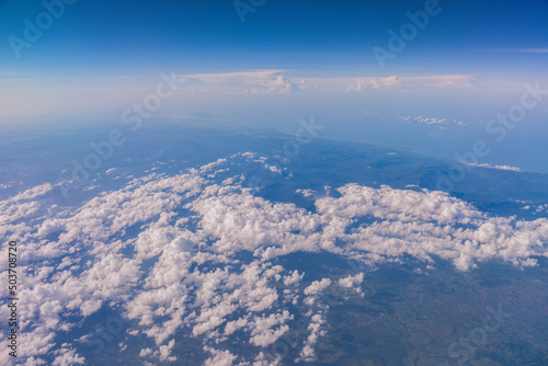 Aerial view of cloud and sky from airplane  Cloudy Sky Background  Aerial View  Horizontal View  Traveling concept.