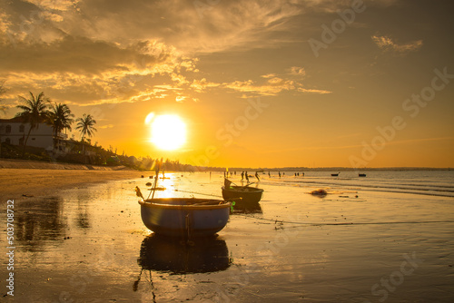 Muine, Binh Thuan Beach, Vietnam - October 31 2015: Fisherman boats at the beach in Mui Ne or Phan Thiet at Vietnam in sunrise . photo