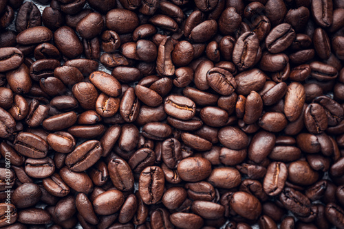 Roasted coffee beans background. Selective focus