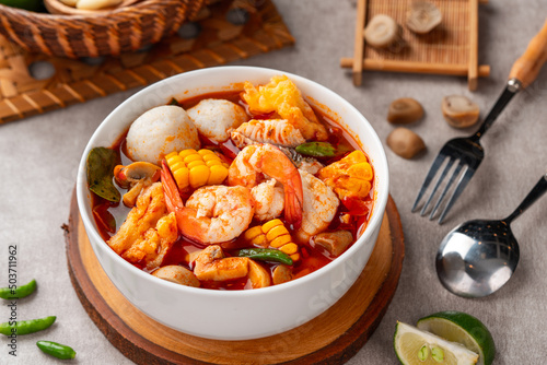 Photography Shrimp soup bowl, Tom yum or tom yam is a type of hot and sour Thai soup, usually cooked with shrimp (prawn)