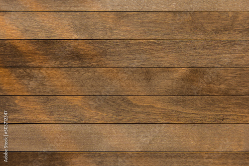 Wooden surface as background texture with rays of light.