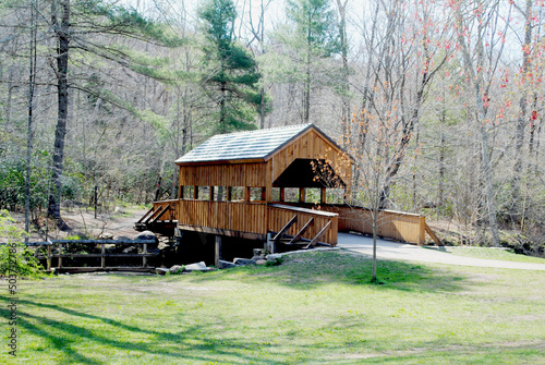 Newly Constructed (2020) Wooden Covered bridge Over the Eightmile river (leads to hiking paths thru a lush green forest) - May 5, 2022, Devil's Hopyard State Park, East Haddam, Connecticut, USA photo