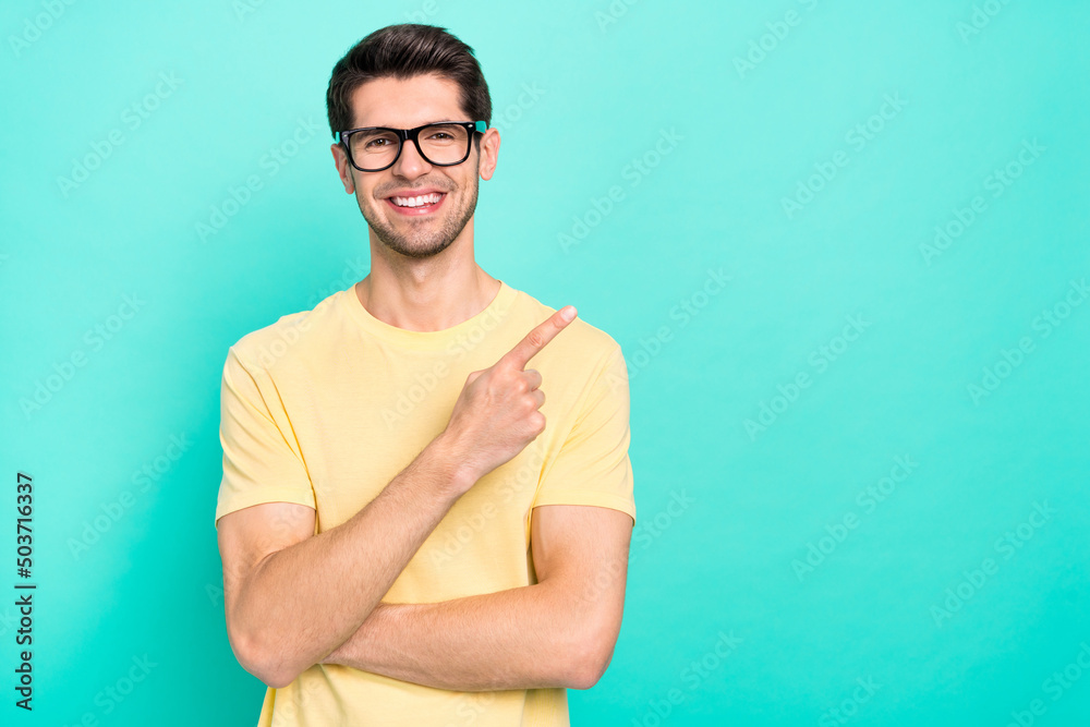 Obraz premium Photo of funny brunet young guy index promo wear eyewear yellow t-shirt isolated on turquoise color background