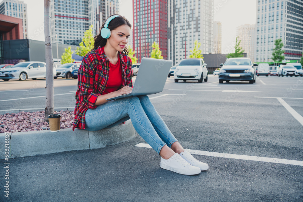 Profile side view portrait of attractive skilled girl coder using laptop writing html database code programming outdoors Profile side view portrait of attractive skilled girl coder using laptop writing html database code programming outdoors