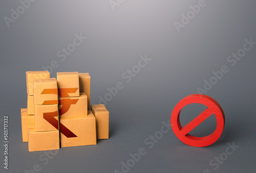 Indian rupee goods boxes and prohibition symbol NO. Ban on import goods. Impossibility of transportation, oversupply. Sanctions and embargoes. Shortage of goods. Confiscation of contraband. Trade wars photo