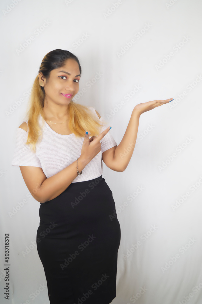 Smiling woman standing in front of white background , Nikita Dev Smiling woman standing in front of white background , Nikita Dev