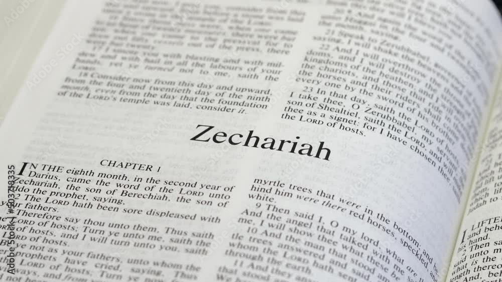Close Up Shot of Bible Page Turning to the book of Zechariah Close Up Shot of Bible Page Turning to the book of Zechariah