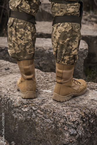 A soldier shod in special tactical khaki shoes