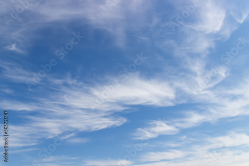 Blue sky with light white clouds. Heavenly natural background