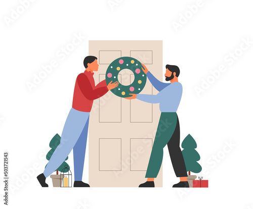 Lgbt couple hangs a Christmas wreath on the door. Family decorates house for the holiday celebration. Flat vector illustration.