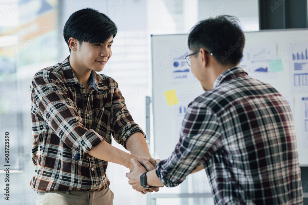 Handshake. Young men shaking hands with colleagues in the office. Handshake. Young men shaking hands with colleagues in the office.