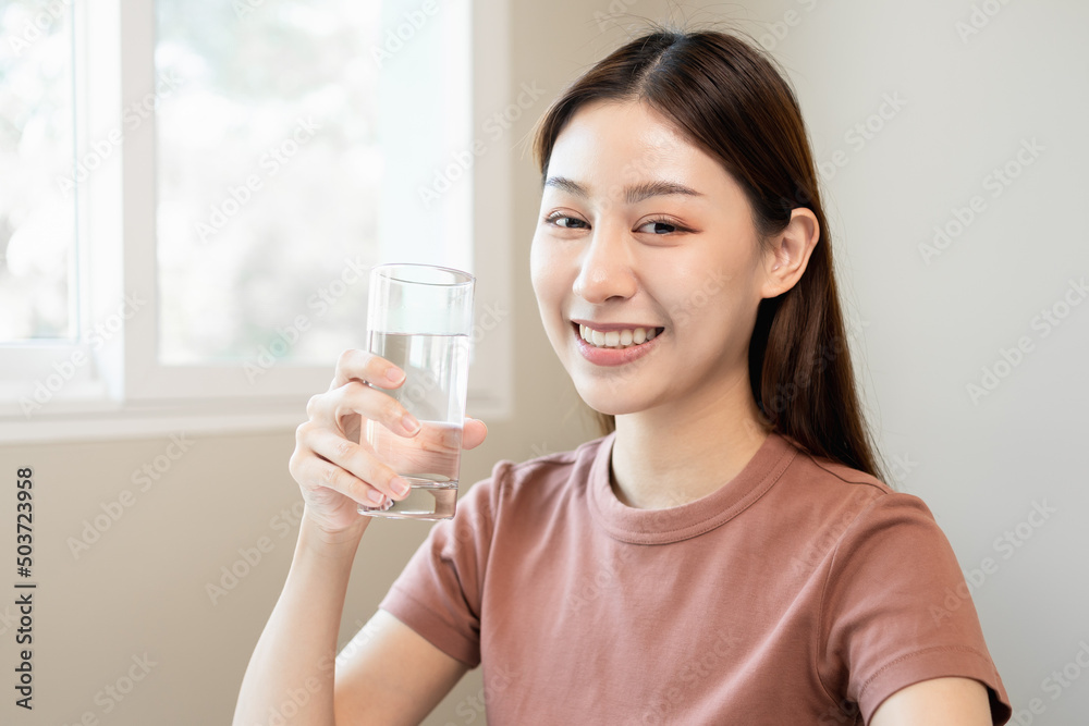 Clean freshwater concept. Woman drink mineral water in the morning for good health. Clean freshwater concept. Woman drink mineral water in the morning for good health.