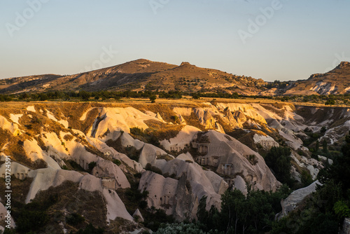 Landscape of rock formations and hills in the Piegon Valley, Cappadocia, Turkey photo