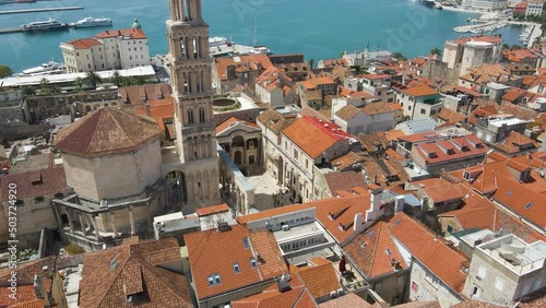 Tourists Visit The Saint Domnius Cathedral And Vestibul In Diocletian's Palace, Split, Croatia. - aerial tilt down photo