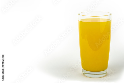 single glass of orange juice isolated on white background