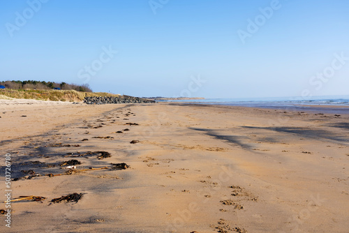 A cloudless spring morning on East Chevington Bay beach on the Northumbrian coast.