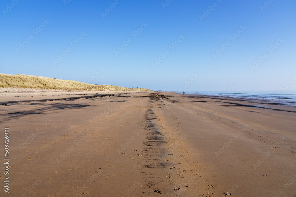 A blue sky spring morning on East Chevington Bay beach in Northumberland