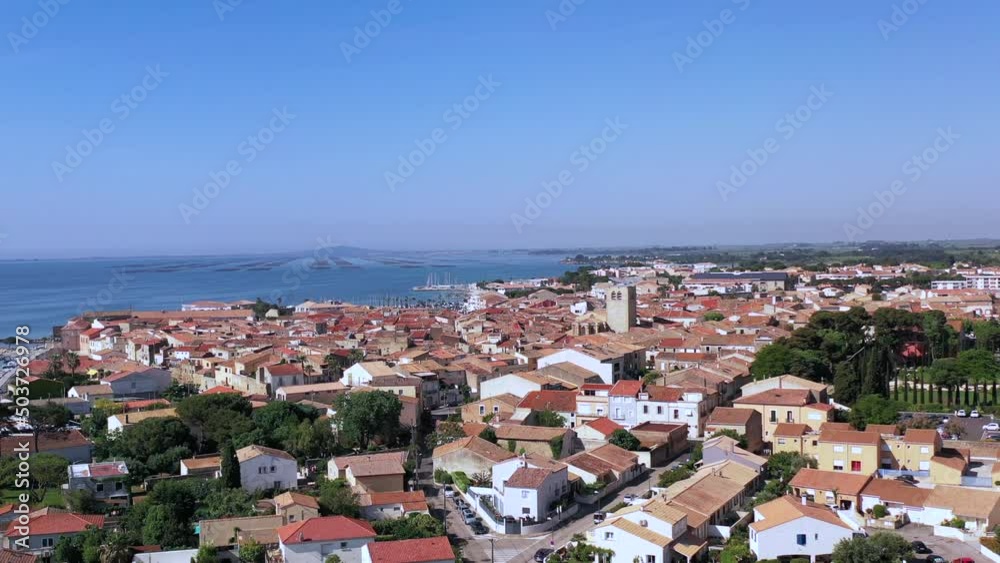 Aerial view of the village of Meze, on a spring day, in Herault in Occitanie, France Aerial view of the village of Meze, on a spring day, in Herault in Occitanie, France
