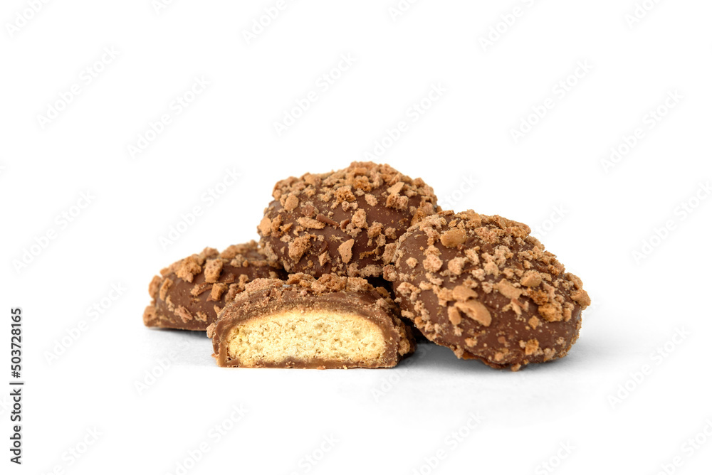Shortbread cookies in milk chocolate glaze and crumbs isolated on white background. Shortbread cookies in milk chocolate glaze and crumbs isolated on white background.
