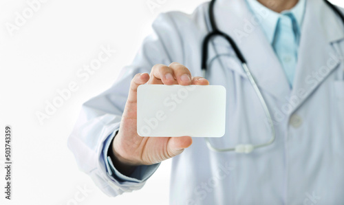 Doctor holding blank card isolated on white background