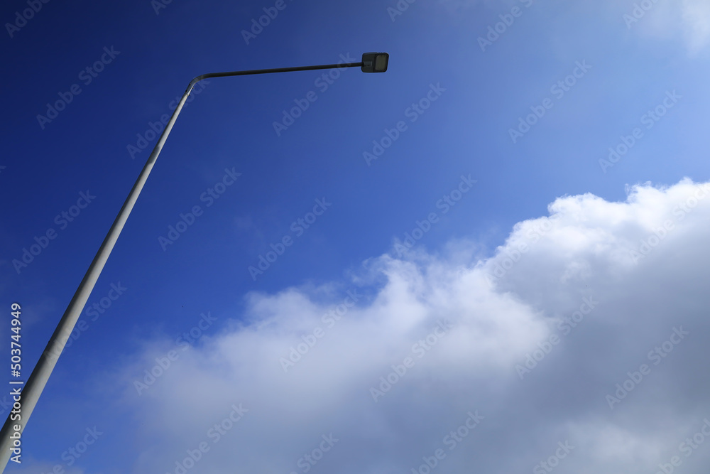 Street light poles and blue sky with cloud. Street light poles and blue sky with cloud.