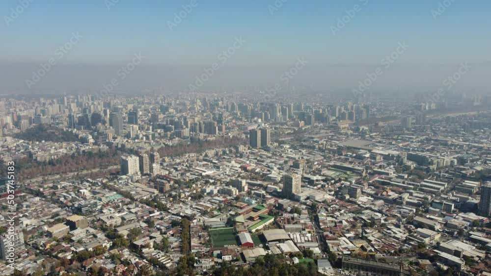 Panoramic view of Santiago de Chile from the Cerro San Cristobal Park. Pollution fog in the big city Panoramic view of Santiago de Chile from the Cerro San Cristobal Park. Pollution fog in the big city