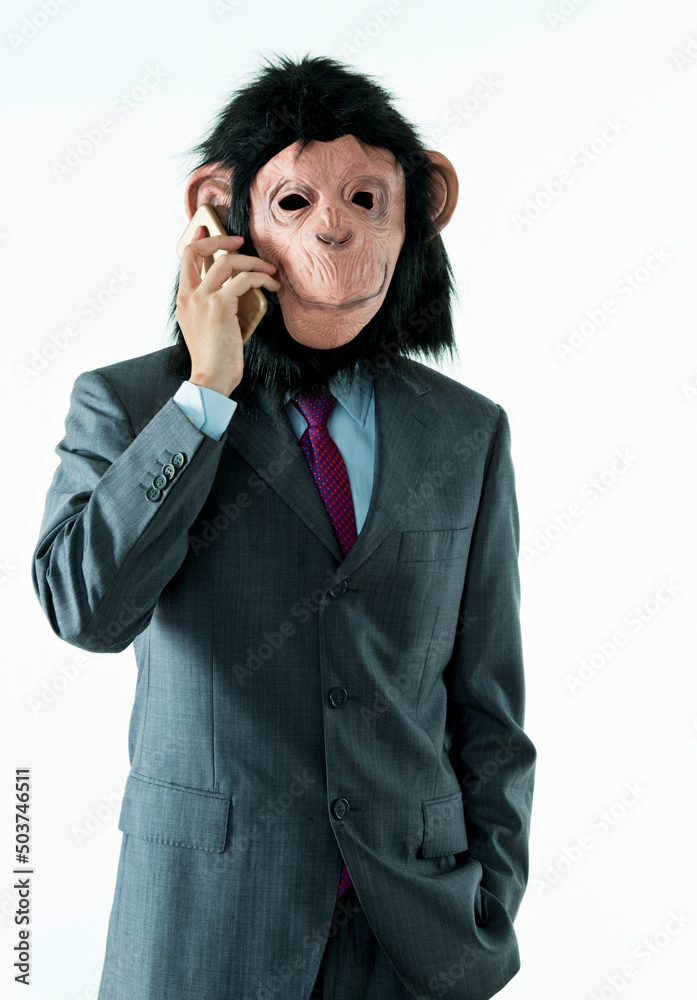 Businessman with head of monkey on white background Businessman with head of monkey on white background