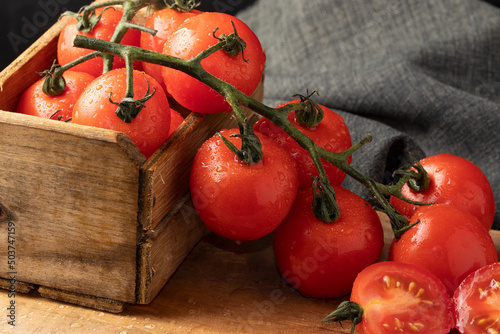 Cherry tomatoes in wooden box © RoYam