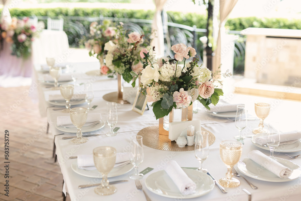 Luxurious setting of the wedding banquet table. Luxurious setting of the wedding banquet table.