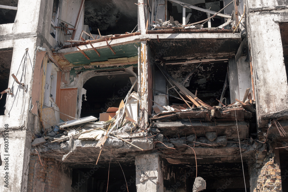 Destroyed apartments in the house after being hit by a downed rocket. A multi-storey building destroyed by a missile