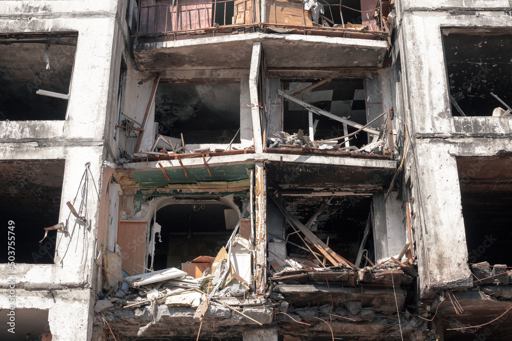 Destroyed apartments in the house after being hit by a downed rocket. A multi-storey building destroyed by a missile