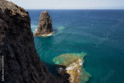 Seascape with big rock and cliff © JuanCarlos
