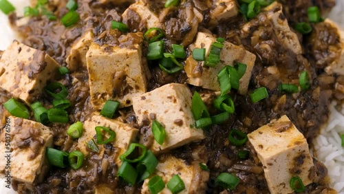 Vegan Mapo tofu with mushroom and rice. Asian, Chinese food. Rotating video