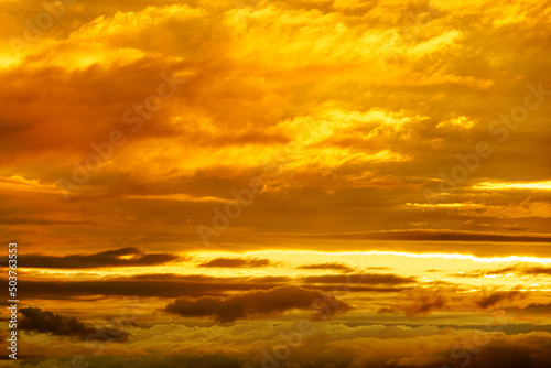 Colorful sunset in the evening sky. Great dramatic view. Clouds illuminated by the setting sun. Amazing sky panorama. Meditative calmness and greatness. Mystical lighting