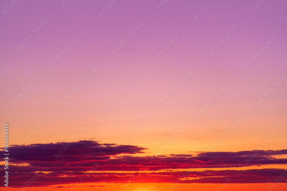 Mystical lighting. Great dramatic view. Colorful sunset in the evening sky. Meditative calmness and greatness. Amazing sky panorama. Clouds illuminated by the setting sun