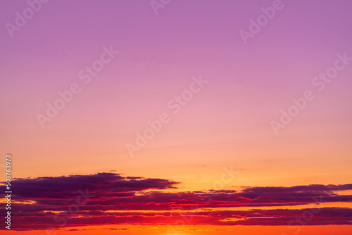 Mystical lighting. Great dramatic view. Colorful sunset in the evening sky. Meditative calmness and greatness. Amazing sky panorama. Clouds illuminated by the setting sun © watman
