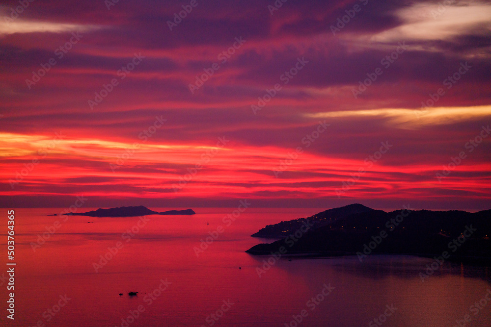 Colorful sunset in the evening sky. Great dramatic view. Clouds illuminated by the setting sun. Amazing sky panorama. Meditative calmness and greatness. Mystical lighting