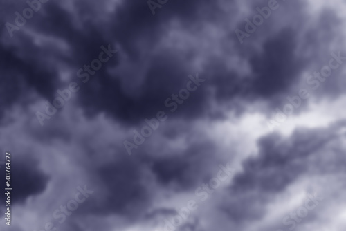Cloudy clouds on a rainy day. Gray clouds in the dark sky. Beautiful background. Stormy summer sky. Strong cloud cover, bad weather. A storm warning. Heaven and infinity