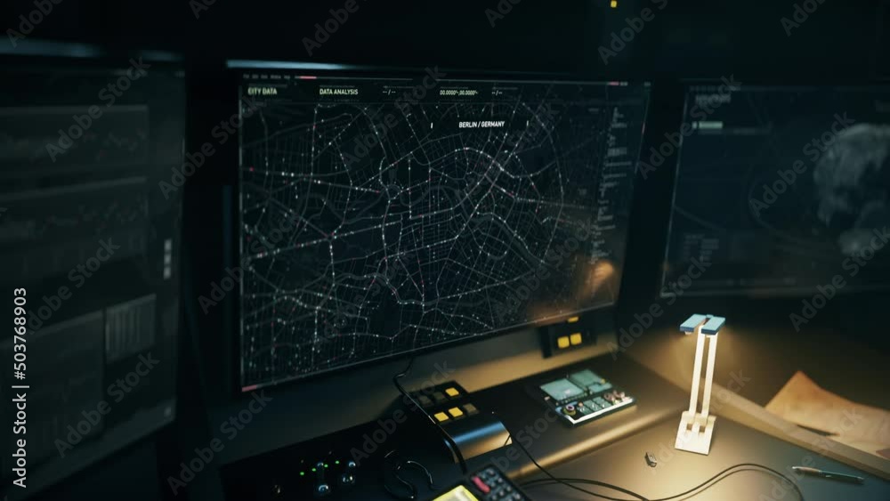 Scanner tech is examining the digital gps map of a major city. Scanner