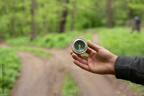 compass in man hand .nature background