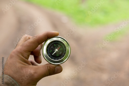compass in man hand .nature background