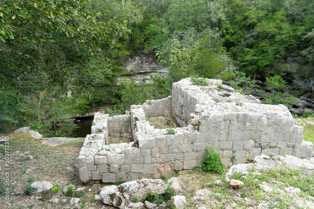 The ruins of the altar in front of the Mayan sacred cenote an UNESCO Heritage Centre. 