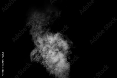 Perfect mystical curly white steam or smoke isolated on black background. Abstract background fog or smog, design element, layout for collages.
