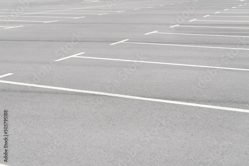 A car parking area with white painted lines, no cars parked. All places are available.